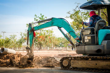 Track-type loader excavator machine on construction site