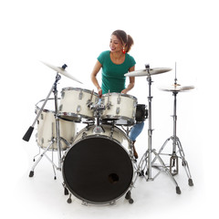 Fototapeta na wymiar brunette brazilian woman plays the drums in studio