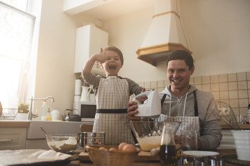 A father and his son cooking