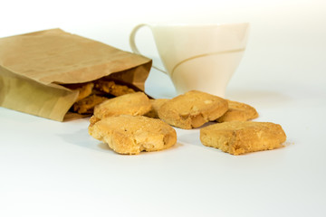 Cookies in paper bag and a cup of coffee