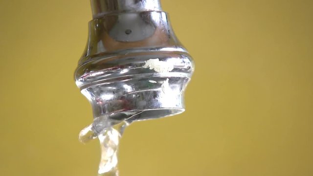 Faucet being turned on and then off.
