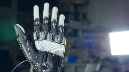 Robotic arm. Futuristic cyborg arm in action. 4K