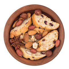 Cookies with raisins and nuts in a ceramic plate. Isolated on wh