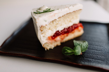 a piece of cake on dark dish