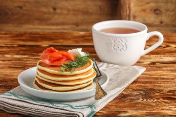 Potato and cheese pancakes with salted red fish cream cheese and dill. Breakfast. Selective focus
