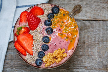 Breakfast smoothie berry bowl with chia, passion fruit and nuts. Clean eating, vegetarian, raw, detox, dieting concept