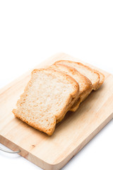 Four pieces of sliced bread on the wooden cutting board on the white background.