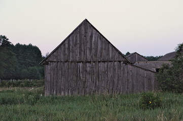 Old weathered wooden barn side view