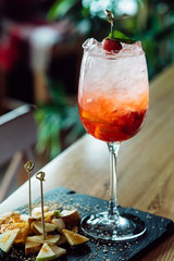 Sangria with apples, oranges and strawberries