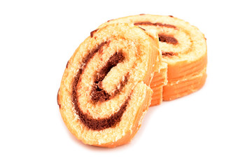 Yellow cake pieces with chocolate isolated on white