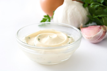 Aioli sauce and ingredients isolated on white background
