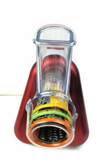 Small electric household appliances for raping and cutting vegetables photographed on white...