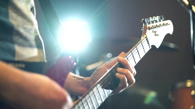 Man singing and playing guitar, Rock band Rehearsal. Guitar closeup. Full HD video footage 1920x1080p Man lead guitarist playing electrical guitar