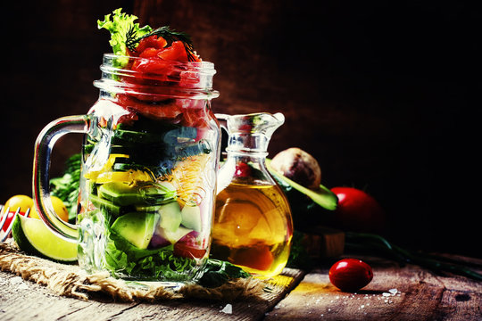 Healthy food: salad with vegetables, lettuce, salmon and shrimp