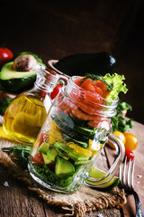 Healthy food: salad with vegetables, lettuce, salmon and shrimp