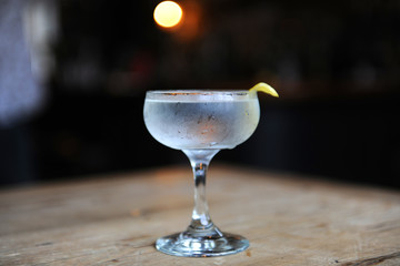Martini with a twist on a bar