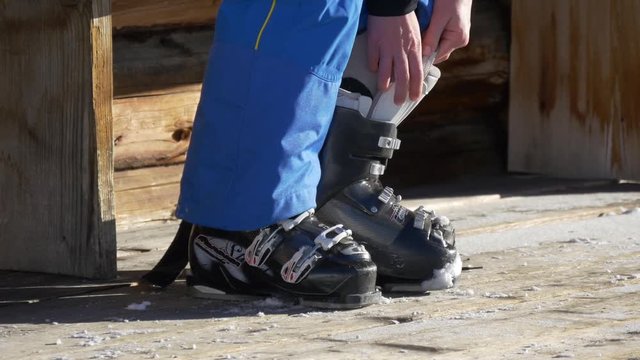 Binding ski boots on a wooden background