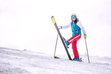 Skiing, winter - happy girl skier on mountain - obrazy, fototapety, plakaty