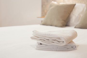 Fototapeta na wymiar Fresh and clean towels in a bright room