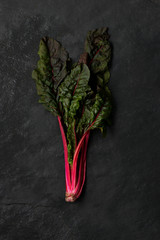Red Chard on a Dark Grey Stone Surface
