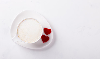 Obraz na płótnie Canvas White Coffee Cup with Milk on a light Background.