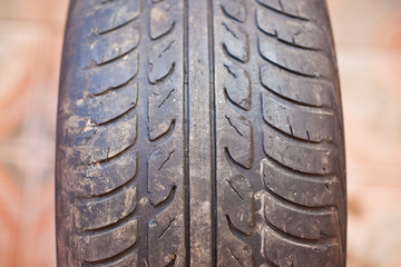 Old car tire with erased tread