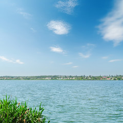 river and blue sky with clouds