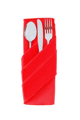Fork, spoon and knife in a red cloth isolated on white