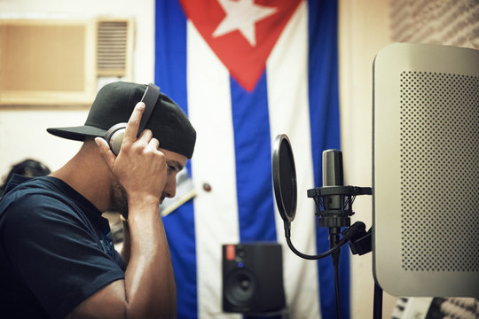 Side view of radio jockey working studio