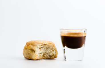 Cup of espresso coffee and scone.