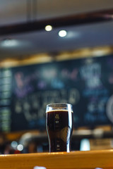 Pint of stout on a table