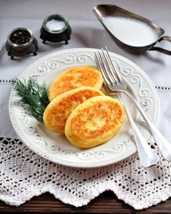 Potato cakes with cheese and yogurt sauce