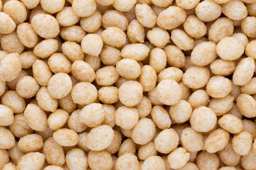 Corn flakes rings on the background.