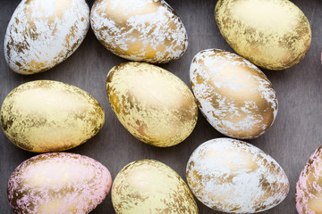 Easter eggs painted in colors on a pattern background.