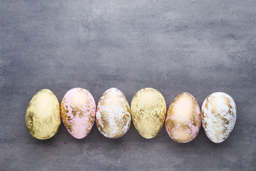 Easter eggs painted in colors on a pattern background.