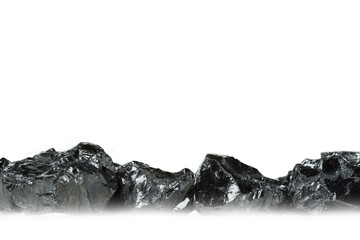 Raw coal nuggets on white background with blured foreground. Nuggets of raw coal isolated on white background