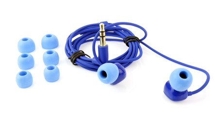 Blue earbuds with replacement cushions. Isolated.