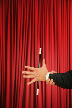 Magician performing trick with magic wand