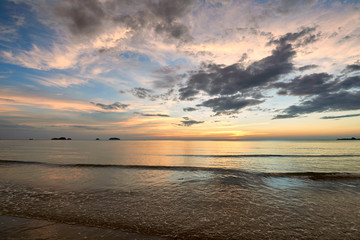 Naklejka na ściany i meble Coast of the sea at colorful sunset Koh Chang, Thailand. Beach s