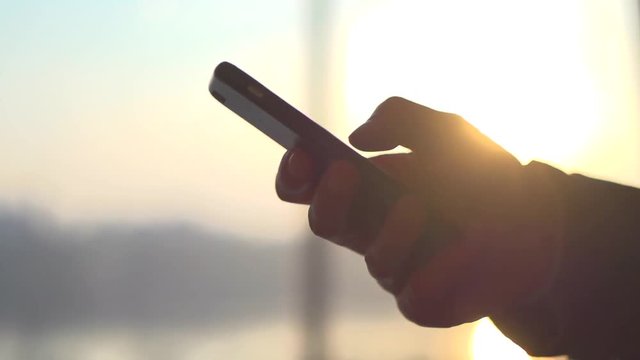 Man's hand touching smart phone surface touchscreen closeup. Full HD 1080p