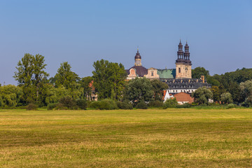 Lad Abbey is a former Cistercians monastery in Lad (village), Poland. Lad Abbey is designated an official Polish Historic Monument.