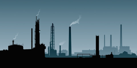 Fototapeta na wymiar A silhouette of a heavy industrial area with smokestacks and factories.
