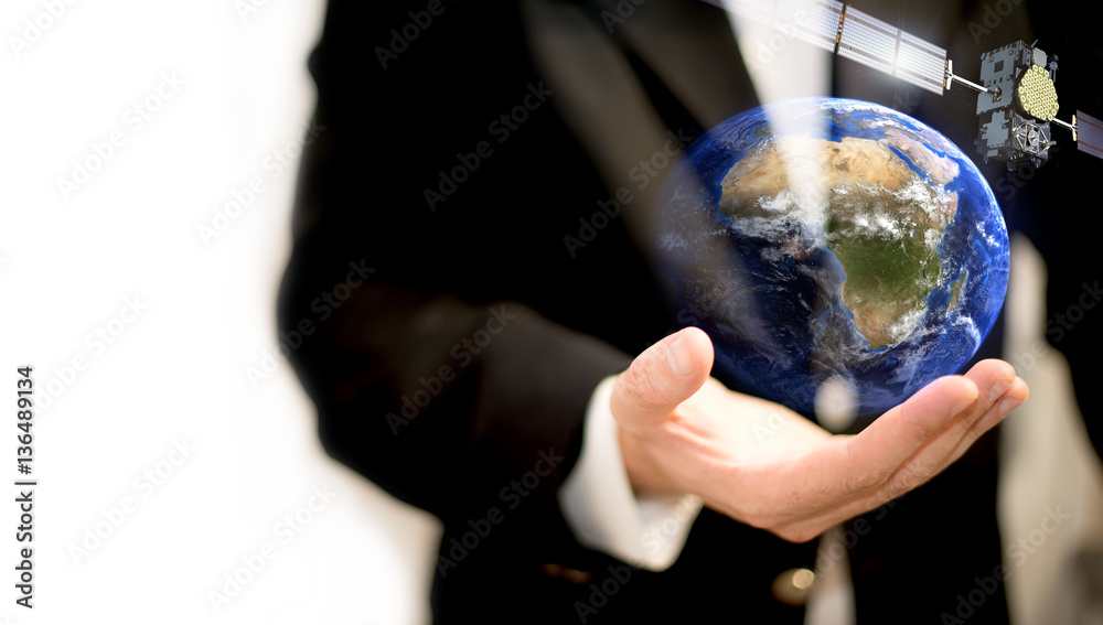 Wall mural man holding planet earth