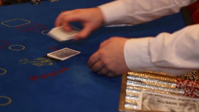 dealer deals the cards in a casino