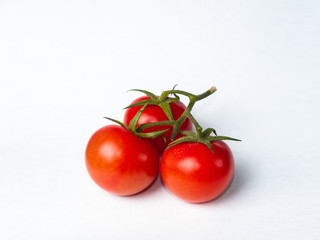 Three isolated tomatos
