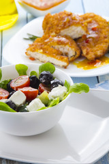 Greek salad kitchen blue wooden background
