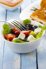 Greek salad kitchen blue wooden background
