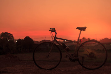 Fototapeta na wymiar Bicycle and sunset.