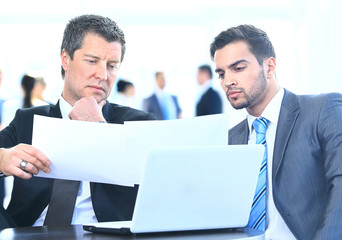 Business men discussing together in an office