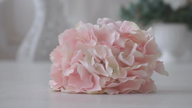 Beautiful bouquet of artificial flowers for decoration falls on the floor. Flowers lie on the floor. Wedding background is